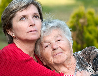 Woman caring for her elderly mother